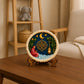 Colourful moon, stars, lantern and floral DIY craft displayed on a wooden stand.