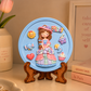 Girl character DIY POP craft with round blue base, colourful dress, elephant, moon, cloud, heart and cupcake motifs