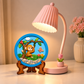 Round DIY monkey painting craft with cartoon monkey on a tree, colourful butterfly, flowers and green nature details.