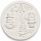 White unpainted circular Christmas craft plaque with raised Santa Claus, snowman, Christmas tree and snowy cottage designs.