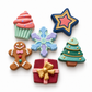 Colourful Christmas DIY craft magnets featuring cupcake, star, snowflake, gingerbread man, gift box and Christmas tree