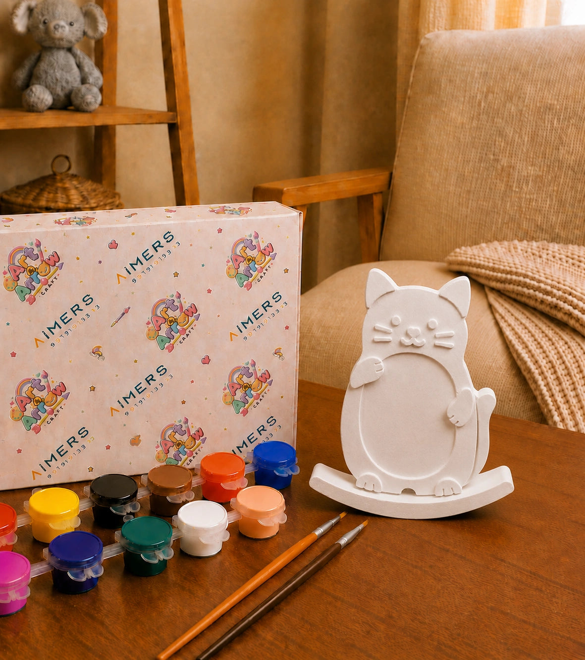 White cat DIY photo frame with paint pots and brushes