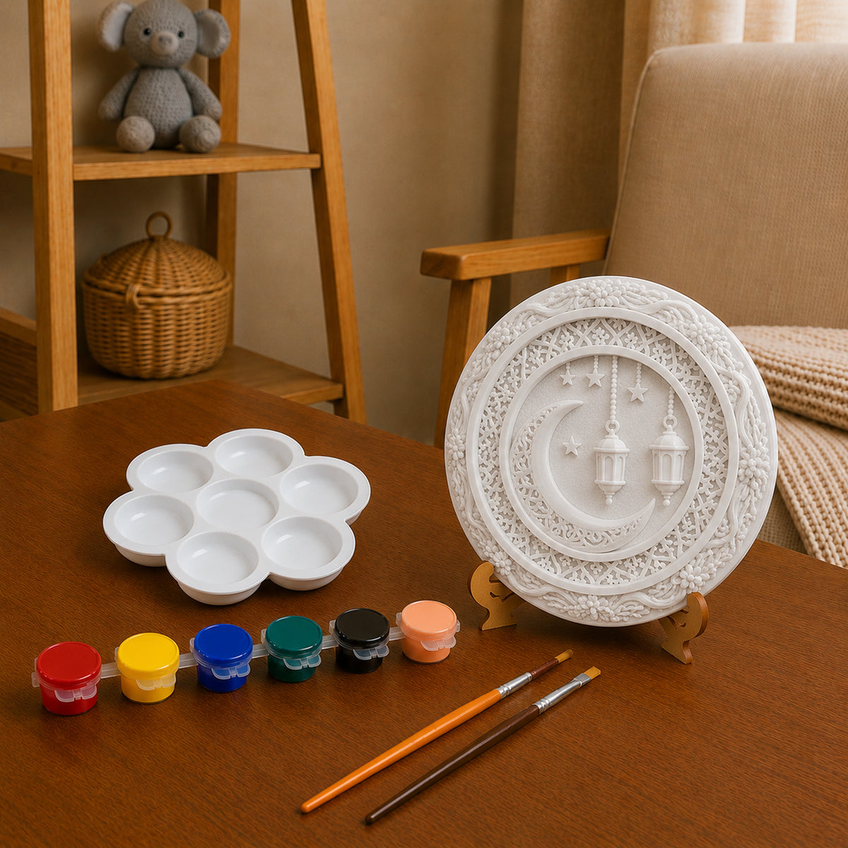 Unpainted crescent moon and lantern DIY craft with paints, palette and brushes.