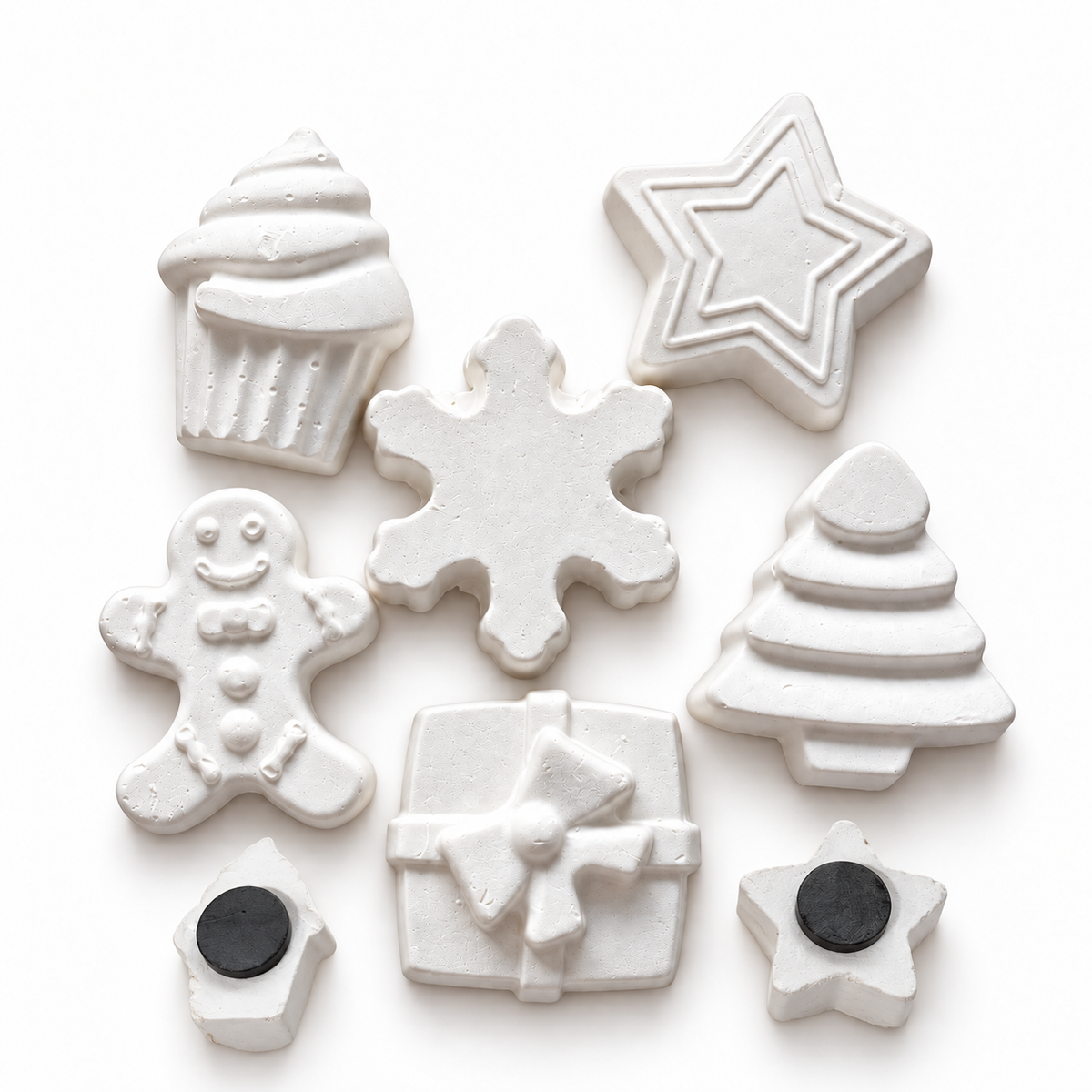 White unpainted Christmas DIY craft shapes with cupcake, star, snowflake, gingerbread man, gift box and Christmas tree designs