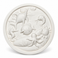 White unpainted round DIY ocean craft plaque featuring raised dolphin, fish, octopus, seahorses, crab and underwater plant designs ready for painting.